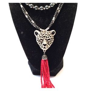 Cheetah head with red tassel